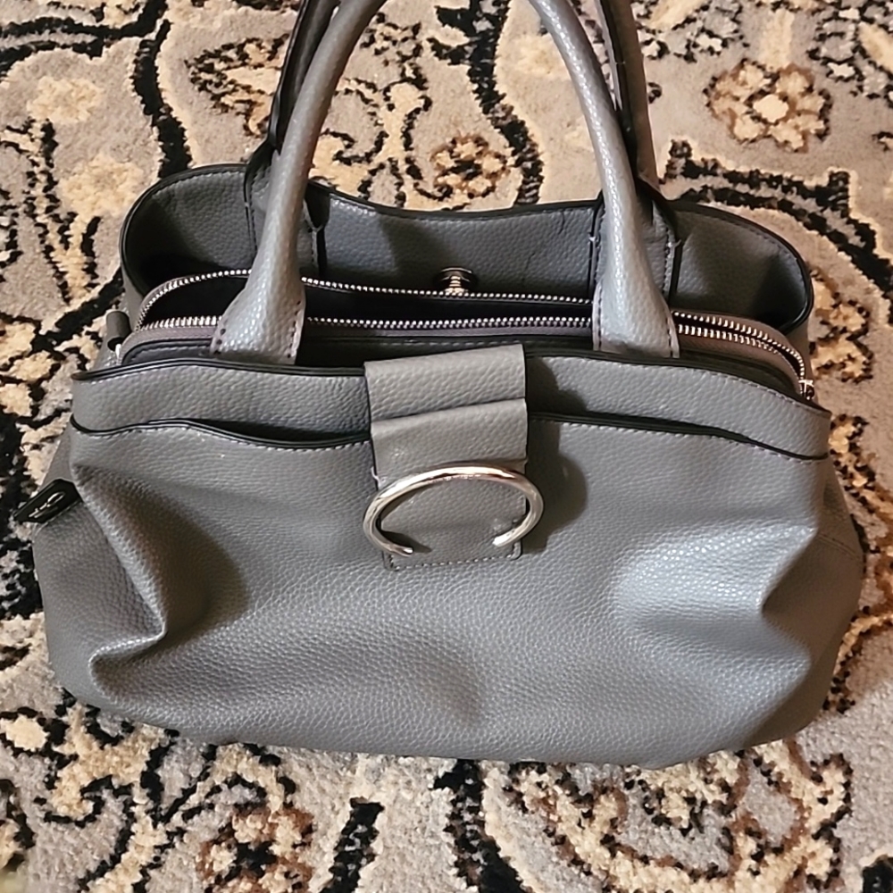 9W purse it's gray and it's medium size it has lots of room .